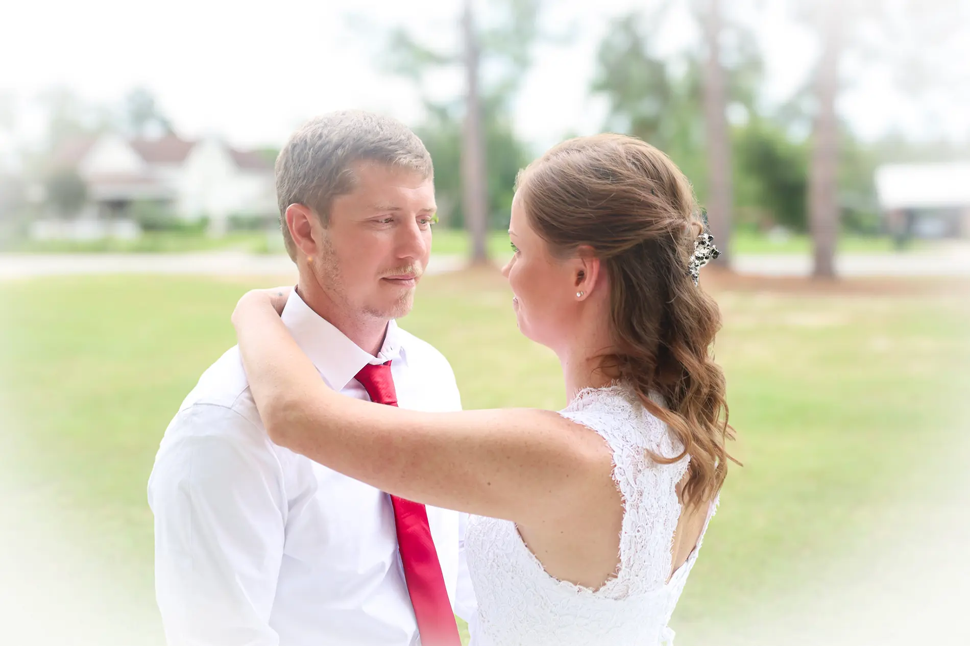 Newlyweds sharing a quiet moment outdoors
